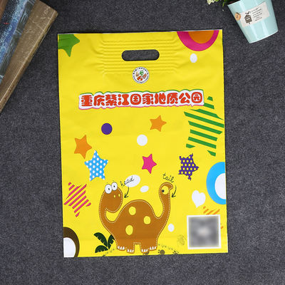 Matériau LDPE Sacs en plastique imprimés sur mesure, sacs à poignée perforés renforcés