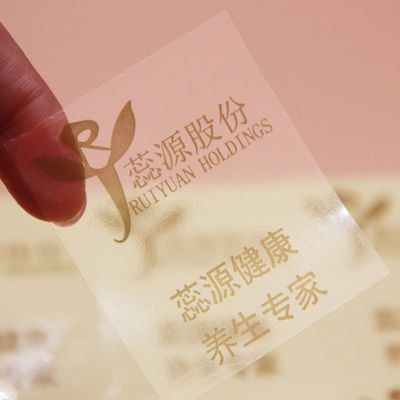 Étiquettes d'étiquettes de logo transparentes en PVC en forme de rectangle avec estampage en feuille d'or