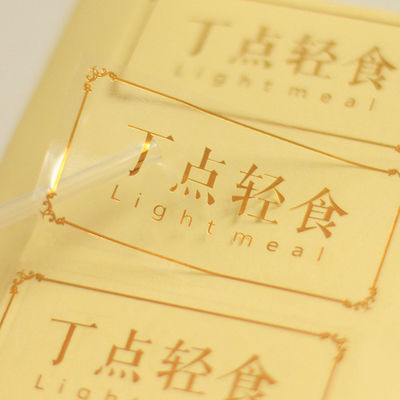 Étiquettes d'étiquettes de logo transparentes en PVC en forme de rectangle avec estampage en feuille d'or